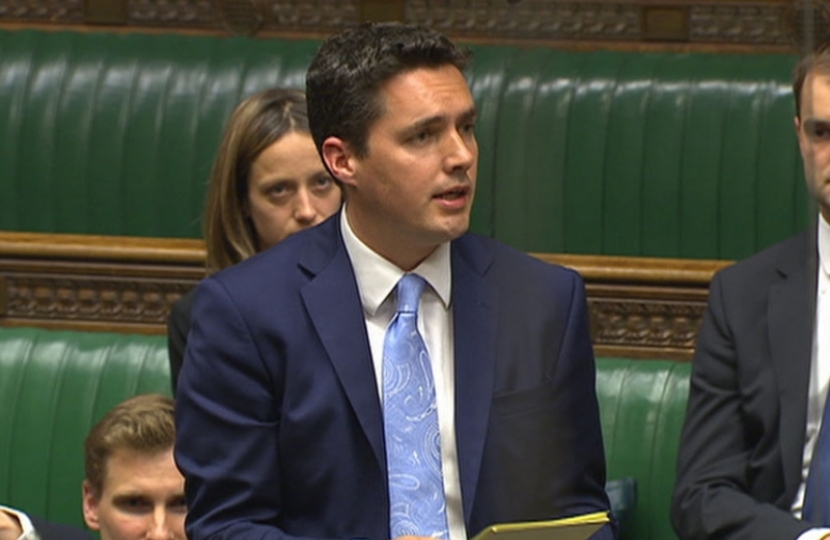 Huw speaking in Chamber