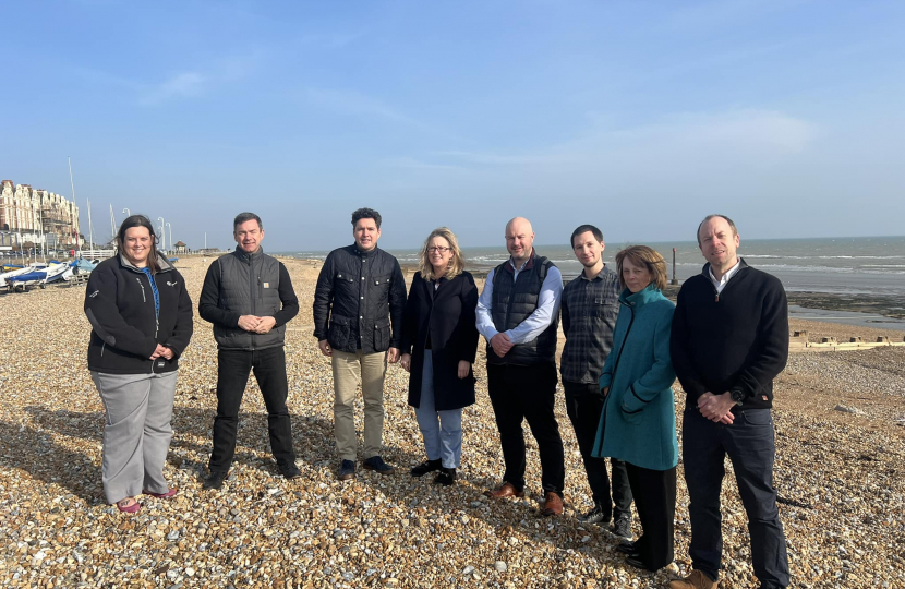Huw Merriman, Sally-Ann Hart and representatives from Southern Water and EA standing on beach in Bexhill