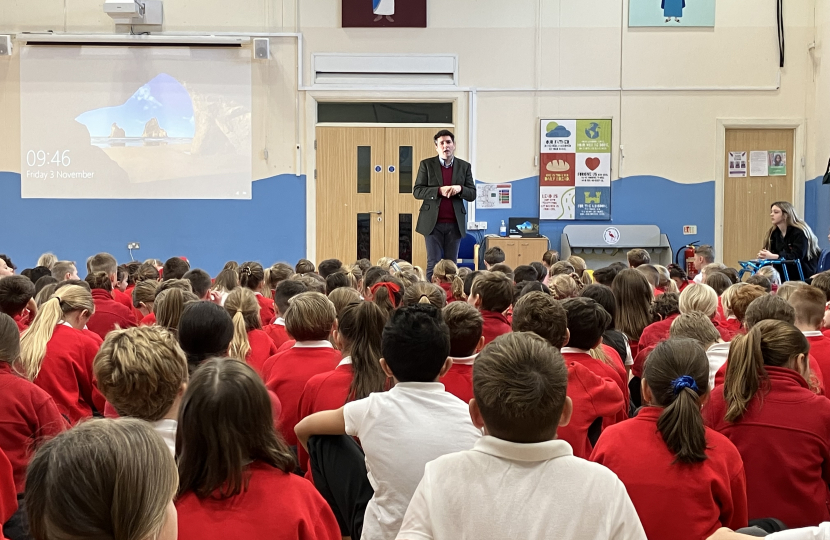 Huw talking to whole school assembly