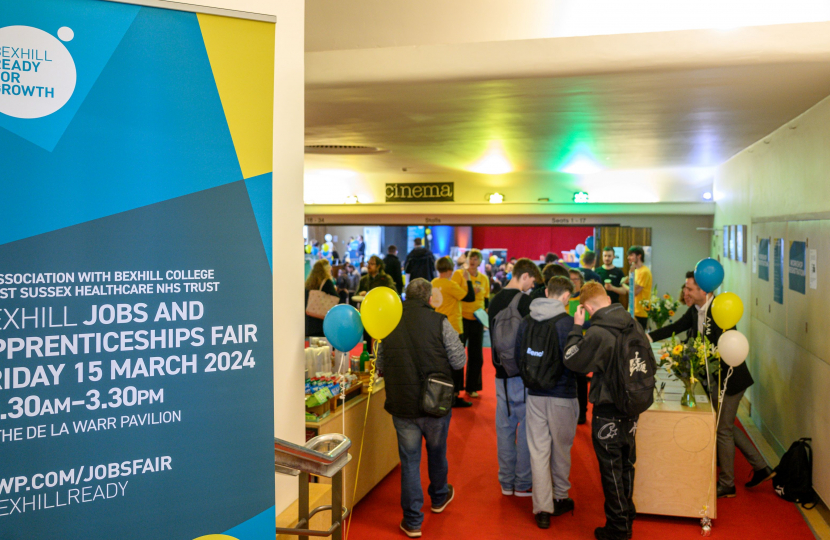 Image of entrance to Jobs Fair showing people signing in