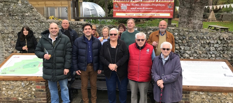 Pevensey community standing with tourism boards