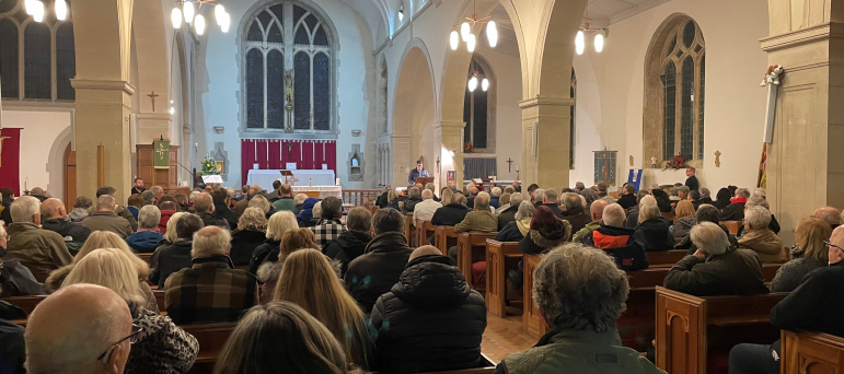 Photo of public meeting on Northeye from rear of church