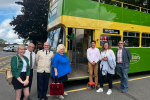 Photo of Huw, Caroline Ansell and Pevensey parish council in front of bus