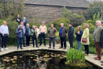 Huw and parish councillors at sunken garden in Great Dixter talking to Head Gardener, Fergus Garrett