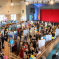 Photo taken at Bexhill Jobs Fair of room full of people having conversations