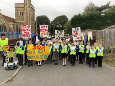 Huw with pupils of All Saints taking part in protest about road safety