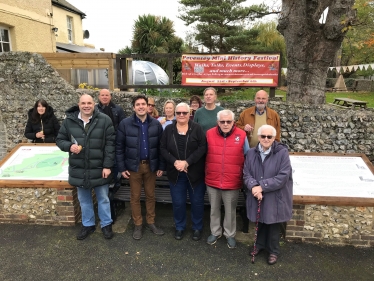 Pevensey community standing with tourism boards
